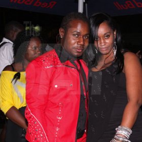 Anthony Minott/Freelance Photographer
Container Boss, ian 'Don Ian' Miles pose beside a lady friend during Container Boss, Ian "Don Ian' Miles Birth night party at 2 Chelsea Avenue, New Kingston, Saturday, January 21, 2012.