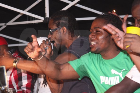 Anthony Minott/Freelance Photographer
DJ Bounty Killer (left), and promoter Don Ian 'fired up' during Container Satdayz, the lollipop edition, held on Regent Street, Down Town, Kingston, on Saturday, November 12, 2011.
