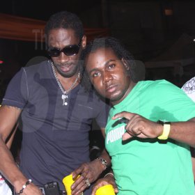 Anthony Minott/Freelance Photographer 
DJ Bounty Killer (left) pose alongside Container Satdayz promoter Don Ian