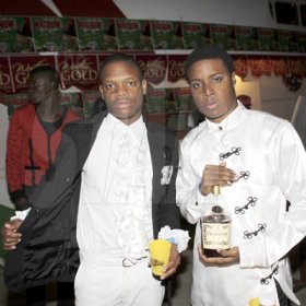 Anthony Minott/Freelance Photographer
The Dapper youths pose with their Hennessey, as it was 'flossing time' during Container Satdayz Boat Ride edition, Caribbean Queen, 3 Port Royal Street, Down Town, Kingston, on Christmas Eve, Saturday, December 24, 2011.
