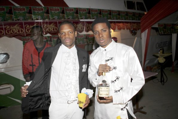 Anthony Minott/Freelance Photographer
The Dapper youths pose with their Hennessey, as it was 'flossing time' during Container Satdayz Boat Ride edition, Caribbean Queen, 3 Port Royal Street, Down Town, Kingston, on Christmas Eve, Saturday, December 24, 2011.