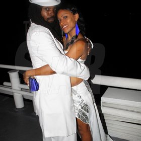 Anthony Minott/Freelance Photographer
A couple has a cozy embrace during Container Satdayz Boat Ride edition, Caribbean Queen, 3 Port Royal Street, Down Town, Kingston, on Christmas Eve, Saturday, December 24, 2011.