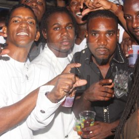 Anthony Minott/Freelance Photographer
Don Ian (second left), the promoter, and his crew pose for a photo during the party series, Container Satdayz on location, Regent Street, down town Kingston, on Saturday, October 1, 2011.