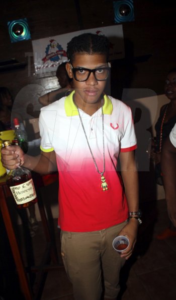 Anthony Minott/Freelance Photographer
With Hennessey in hand he's ready to party during Sher RumBar and Jodi Couture's Magnum Couture Girls party at the Village Blue Cafe, Barbican Road, in St Andrew on Saturday, June 16, 2012.