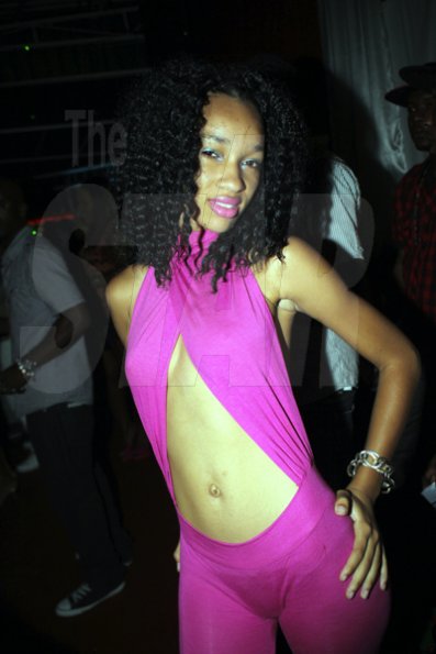Anthony Minott/Freelance Photographer
Pretty in pink she yearns for the spotlight during Sher RumBar and Jodi Couture's Magnum Couture Girls party at the Village Blue Cafe, Barbican Road, in St Andrew on Saturday, June 16, 2012.