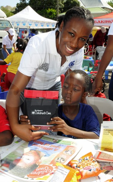 Gladstone Taylor / Photographer

after school event for children from basic schools chosen by the national child month committee from downtown kingston. held at the Gleaner's parking lot along east street.