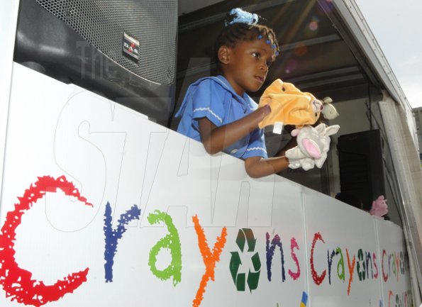 Gladstone Taylor / Photographer

Mishka Moncrieffe (elletson methodist early childhood) plays with two hand puppets from the crayons count learning lorry

an after school event for children from basic schools chosen by the national child month committee from downtown kignston. held at the Gleaner's parking lot along east street.