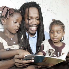 Gladstone Taylor / Photographer

Minister of State for Tourism Damion Crawford reads to  Dejanea Mcintyre (left) and Xarian Taylor (right) both students of Pentab Early Childhood Institution in the crayons count learning lorry yesterday in Central Kingston.


an after school event for children from basic schools chosen by the national child month committee from downtown kignston. held at the Gleaner's parking lot along east street.