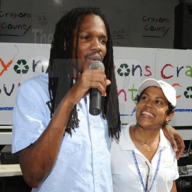 Gladstone Taylor / Photographer

Minister of State Damion Crawford (right) thanks Deika Morrison (Crayons Count Founder) for the opportunity to participate in the after school event for children from basic schools chosen by the national child month committee from downtown kignston. held at the Gleaner's parking lot along east street.