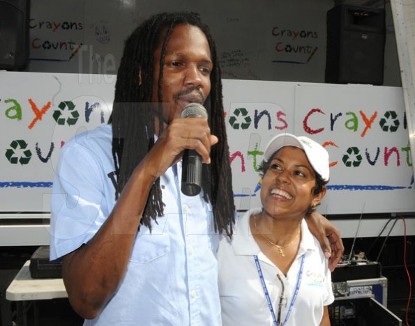 Gladstone Taylor / Photographer

Minister of State Damion Crawford (right) thanks Deika Morrison (Crayons Count Founder) for the opportunity to participate in the after school event for children from basic schools chosen by the national child month committee from downtown kignston. held at the Gleaner's parking lot along east street.