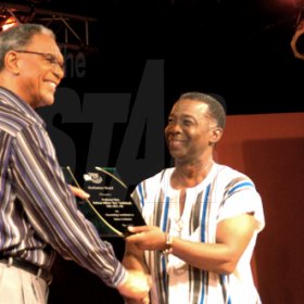 Winston Sill / Freelance Photographer
Clive Thompson (left) collects a posthumous award on behalf of Professor Rex Nettleford from Sydney Bartley, Director of Culture. Looking on is Dancin' Dynamites host Jenny Jenny.




   


Red Label Wine "Dancin Dynamites Competition", held at Half Way Tree Entertainment Centre, Hagley Park Road on Saturday night May 1, 2010.