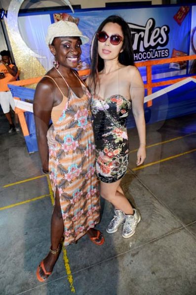 Rudolph Brown/ Photographer<\n>Jennifer ‘Jenny Jenny’ Small, (left) pose with Japanese artist pianist Akiko Moriyako at the semi final of the 2018 Charles Chocolates Dancin’ Dynamites competition at the Jamaica College Auditorium in Kingston on Saturday May 12, 2018<\n><\n>
