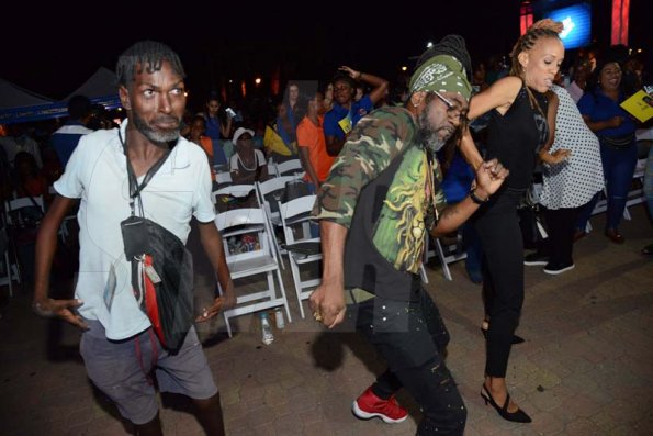 Rudolph Brown/PhotographerJudges Kerry-Ann Henry, (right) and Orville Hall, (centre) dancing at the Charles Chocolates Dancin' Dynamites 2019 Launch at Emancipation Park on Saturday January 5, 2018