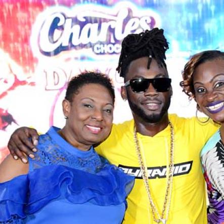 Rudolph Brown/Photographer<\n>Just touch down for Charles Chocolates Dancin Dynamite's <\n>2019 launch is British artiste Stylo G who is sandwiched by the show's producer Jenny Jenny (right) and Olivia Grange, Minister of Culture, Gender, Entertainment and Sport.<\n><\n><\n>