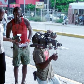 Director Dexter 3D Pottinger as he watches as Ras Tingle films a scene in New Kgn