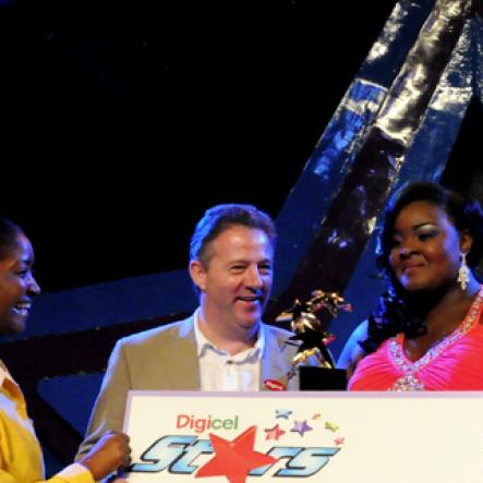 Winston Sill / Freelance Photographer
Digicel Stars Final Show, held at the Courftleigh Auditorium. St. Lucia Avenue, New Kingston on Sunday night September 23, 2012. Here are Jackie Burrell-Clarke (left), of Digicel; Andy Thorburn (second left), CEO, Digicel Jamaica; the winner (second right); and Conor Looney (right), Marketing Director, Digicel.