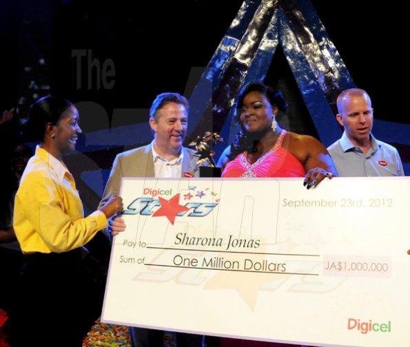 Winston Sill / Freelance Photographer
Digicel Stars Final Show, held at the Courftleigh Auditorium. St. Lucia Avenue, New Kingston on Sunday night September 23, 2012. Here are Jackie Burrell-Clarke (left), of Digicel; Andy Thorburn (second left), CEO, Digicel Jamaica; the winner (second right); and Conor Looney (right), Marketing Director, Digicel.