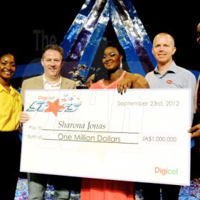 Winston Sill / Freelance Photographer

Digicel Stars Final Show, held at the Courftleigh Auditorium. St. Lucia Avenue, New Kingston on Sunday night September 23, 2012. Here are Jackie Burrell-Clarke (left),of Digicel; Andy Thorburn (second left), CEO, Digicel Jamaica; the winner (centre); Conor Looney (second right), Marketing Director, Digicel; and mentor Conroy ----??? (right),