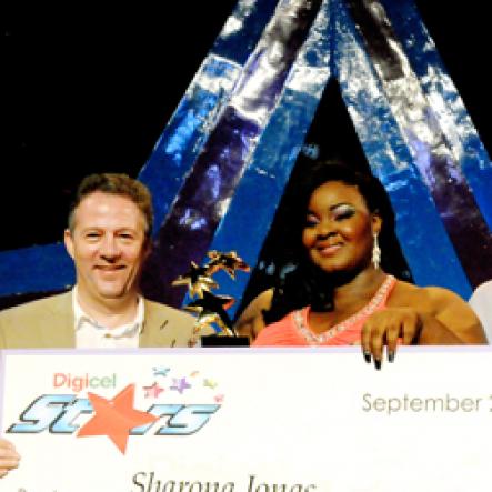 Winston Sill / Freelance Photographer

Digicel Stars Final Show, held at the Courftleigh Auditorium. St. Lucia Avenue, New Kingston on Sunday night September 23, 2012. Here are Jackie Burrell-Clarke (left),of Digicel; Andy Thorburn (second left), CEO, Digicel Jamaica; the winner (centre); Conor Looney (second right), Marketing Director, Digicel; and mentor Conroy ----??? (right),