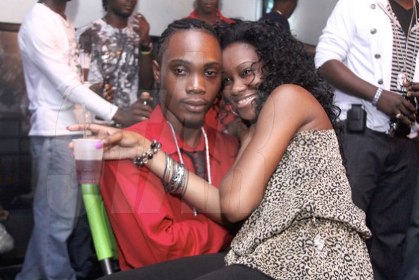 Anthony Minott/Freelance Photographer¶
¶A female fan gets close and personal with DJ Marlon during DJ Marlon and Diego birthday bash at the Club Impulse, New Kingston on Friday, July, 15, 2011.¶
¶