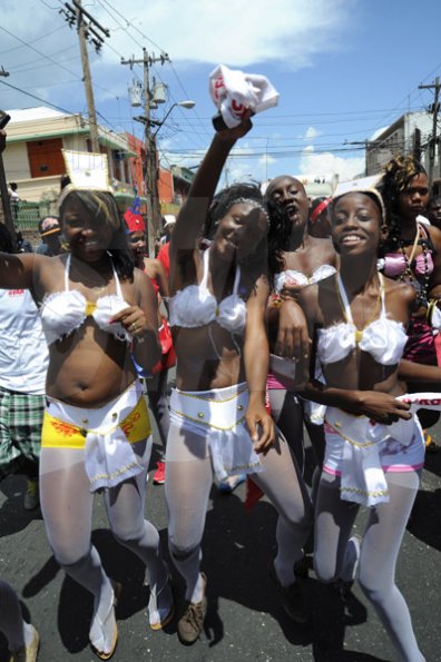 Norman Grindley/Chief Photographer
Revellers in the downtown carnival march along East Queen Street Kingston yesterday.