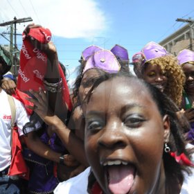 Norman Grindley/Chief Photographer
Revellers in the downtown carnival march along East Queen Street Kingston yesterday.