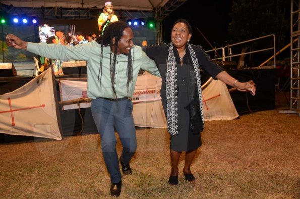 Shorn Hector/Photographer  From LeftMinister of State in the Ministry of Culture, Gender, Entertainment and Sport, Alando Terrelonge, Minister of Culture, Gender, Entertainment and Sport, Olivia Grange dancing together at the Seville Emancipation Jubilee 2018