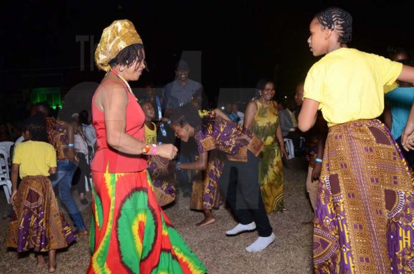 Shorn Hector/Photographer  Left proffesspor Verene Shepherd dancing with members of the  Charles Town Marroons performing at the Seville Emancipation jubilee 2018.