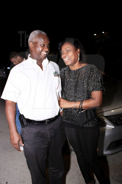 Anthony Minott/Freelance Photographer
Garfield Lettman, National Sales Manager for Wray and Nephew Jamaica Limited shares a light moment with his lady friend during businessman, Lester 'Father Ken' Crooks birthday party at Ken's Wildflower Sports Bar and Lounge, Portmore Plaza, Port Henderson Road, recently.