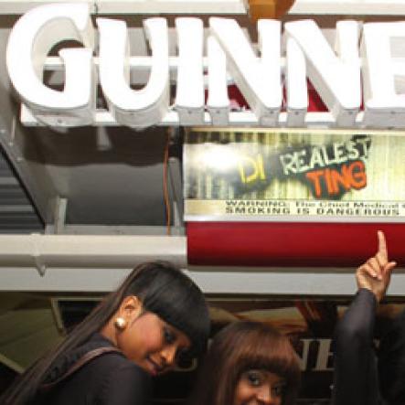 Anthony Minott/Freelance Photographer 
The Guinness girls take a photo opt during his party and customer appreciation day atop the roof of Ken's Wildflower Sports bar, Port Henderson Road, Portmore, St Catherine on Tuesday, March 13, 2012. Hundreds of patrons came to give their support.