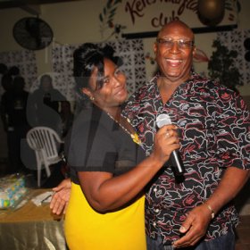 Anthony Minott/Freelance Photographer
Birthday boy, Lester 'ken' Crooks, pose with a female patron during hs birthnight party atop the roof of Ken's Wildflower Sports bar, Port Henderson Road, Portmore, St Catherine on Tuesday, March 13, 2012. Hundreds of patrons came to give their support.