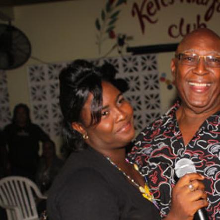 Anthony Minott/Freelance Photographer
Birthday boy, Lester 'ken' Crooks, pose with a female patron during hs birthnight party atop the roof of Ken's Wildflower Sports bar, Port Henderson Road, Portmore, St Catherine on Tuesday, March 13, 2012. Hundreds of patrons came to give their support.