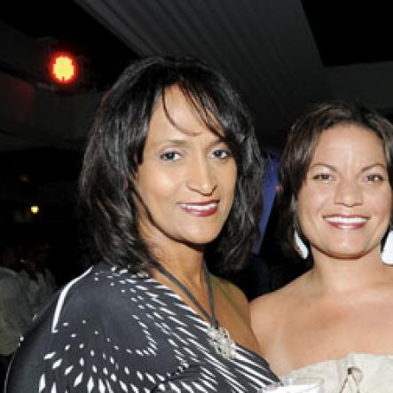 Winston Sill/Freelance Photographer
Gal pals Nicole Touzalin (left) and Danielle Barnes having cocktails.

Flairtatious party held at Guardsman Group on Saturday October 22, 2011.