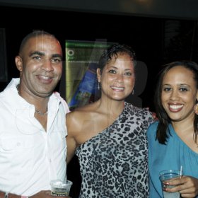 Winston Sill/Freelance Photographer
Chesna Haber (right) lymes with John and Kerry Minott.

Flairtatious party held at Guardsman Group on Saturday October 22, 2011.