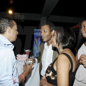 Winston Sill/Freelance Photographer
Gary Barrow (left), wife Bernadette Barrow (second right) and Rejeanne Campbell rap with Wilfred Emmanuel-Jones.

Flairtatious party held at Guardsman Group on Saturday October 22, 2011.