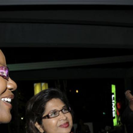 Winston Sill/Freelance Photographer
Millionaire entrepreneur Wilfred Emmanuel-Jones has the attention of Lorraine Clunie (left), of Oasis on the Oxford  and Jean Lowrie-Chin, founder of Flair magazine.

Flairtatious party held at Guardsman Group on Saturday October 22, 2011.