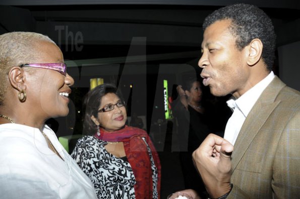 Winston Sill/Freelance Photographer
Millionaire entrepreneur Wilfred Emmanuel-Jones has the attention of Lorraine Clunie (left), of Oasis on the Oxford  and Jean Lowrie-Chin, founder of Flair magazine.

Flairtatious party held at Guardsman Group on Saturday October 22, 2011.