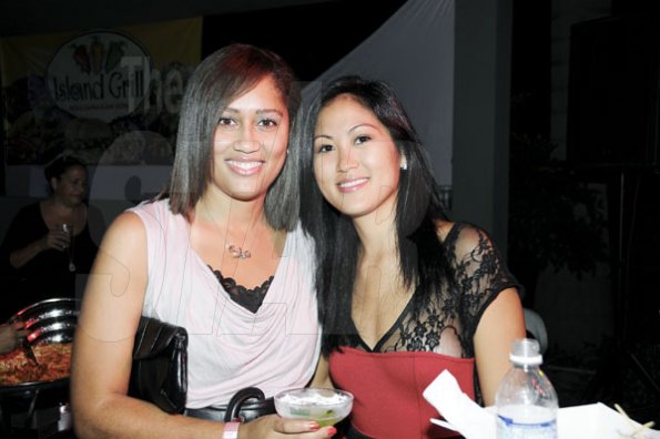 Winston Sill/Freelance Photographer
Red Stripe's Erin Mitchell (left) and Melissa Lue Yen smile for the camera.

Flairtatious party held at Guardsman Group on Saturday October 22, 2011.