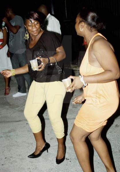 Winston Sill / Freelance Photographer
                                                                                      These two were clearly having fun on the dancefloor as they are seen dropping a few moves here.                                                                                                                                                                                                                                                                                                                                                                                       Stir It Up party, held at Mas Camp, Oxford Road, New Kingston on Saturday night October 3, 2009.