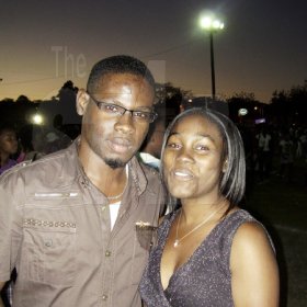 Odean Wright (left) and his lady friend Jodian Patterson share a frame.