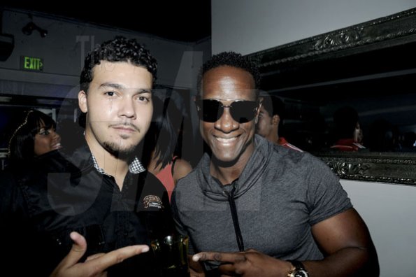 Winston Sill / Freelance Photographer
Jared Samuel (left), of Appleton Jamaica; and Phillip Palmer  hanging out at Appleton's  Black Twilight Halloween Costume Ball.





, held at Club Privilege, Trinidad Terrace, New Kingston on Friday night October 26, 2012. Here are Jared Samuel (left), of Appleton Jamaica; and Phillip Palmer (right).