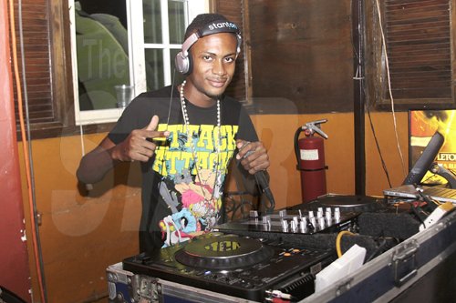 Anthony Minott/Freelance Photographer
DJ Madden in action during Guinness Happy Thursdays  presented by Hapilos Entertainment at the Village Blue Bones Cafe, Barbican Road, in Liguanea, St Andrew on Thursday, September 1, 2011.