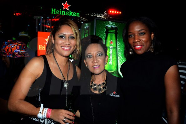 Winston Sill/Freelance Photographer
Red Stripe prsents Heineken World Premiere Party, held at  Fort Rocky, Port Royal on Saturday night November 22, 2014. Here are Erin Mitchell (left), Red Stripe Brand Manager; Dianne Ashton Smith (centre), Head of Corporate Relations, Red Stripe; and Rochelle Clarke (right), Heineken Country Manager.