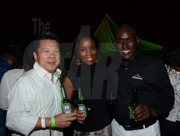 Winston Sill/Freelance Photographer
Red Stripe prsents Heineken World Premiere Party, held at  Fort Rocky, Port Royal on Saturday night November 22, 2014. Here are Brian "Ribbie" Chung (left), Rochelle Clarke (centre), Heineken Country Manager; and Cedric Blair (right) Managing Director, Red Stripe.