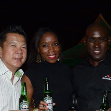 Winston Sill/Freelance Photographer
Red Stripe prsents Heineken World Premiere Party, held at  Fort Rocky, Port Royal on Saturday night November 22, 2014. Here are Brian "Ribbie" Chung (left); Rochelle Clarke (second left), Heineken Country Manager; Cedric Blair (second right), Managing Director, Red Stripe; and Margaret Harvey (right), Head, International Strategy, Heineken.