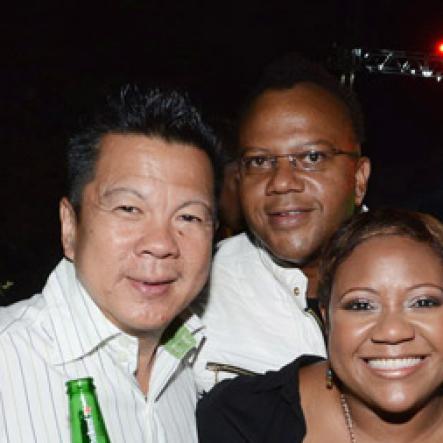 Winston Sill/Freelance Photographer
Red Stripe prsents Heineken World Premiere Party, held at  Fort Rocky, Port Royal on Saturday night November 22, 2014. Here are Brian "Ribbie" Chung (left); Don Creary (second left);  Nasha Douglas (centre), Heineken Brand Manager; and Kamal  Bankay (right).
