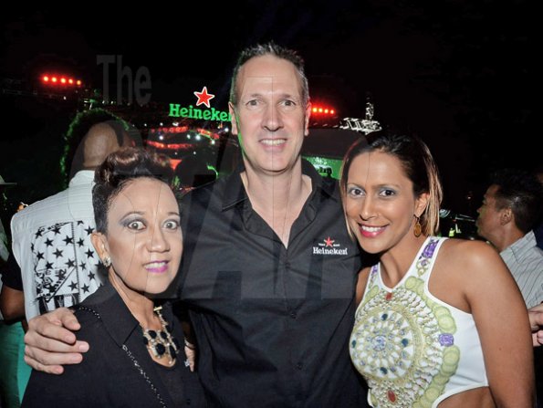 Winston Sill/Freelance Photographer
Red Stripe prsents Heineken World Premiere Party, held at  Fort Rocky, Port Royal on Saturday night November 22, 2014. Here are Dianne Ashton Smith (left), Head of Corporate Relations, Red Stripe; Bruce Kidnor (centre), Finance Director, Red Stripe; and Ayesha Creary (right).