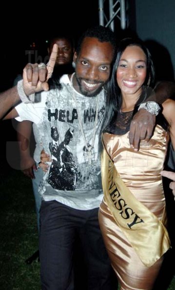 Winston Sill / Freelance Photographer
Mavado hanging out with one of the Hennessy Girls
