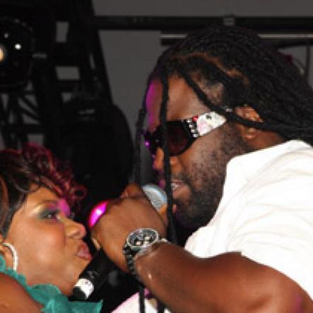 Publication: Daily Star
Photo by Noel Thompson

Radio personality Miss Kitty, gets close-up with 'Gramps', of Morgan Heritage during a performance at Reggae Sumfest International NIght last Friday (July 24, 2009) in Catherine Hall, Montego Bay.