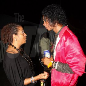Publication: Something Extra/Social
Photo by Noel Thompson

Yolande Rattray-Wright, managing director of The Wright Agency in Kingston gives some advice to Kwan Brooks, Jamaican Michael Jackson, of Savanna-la-Mar, Westmoreland, after his brief performance on stage, at Reggae Sumfest International NIght last Friday (July 24, 2009) in Catherine Hall, Montego Bay.